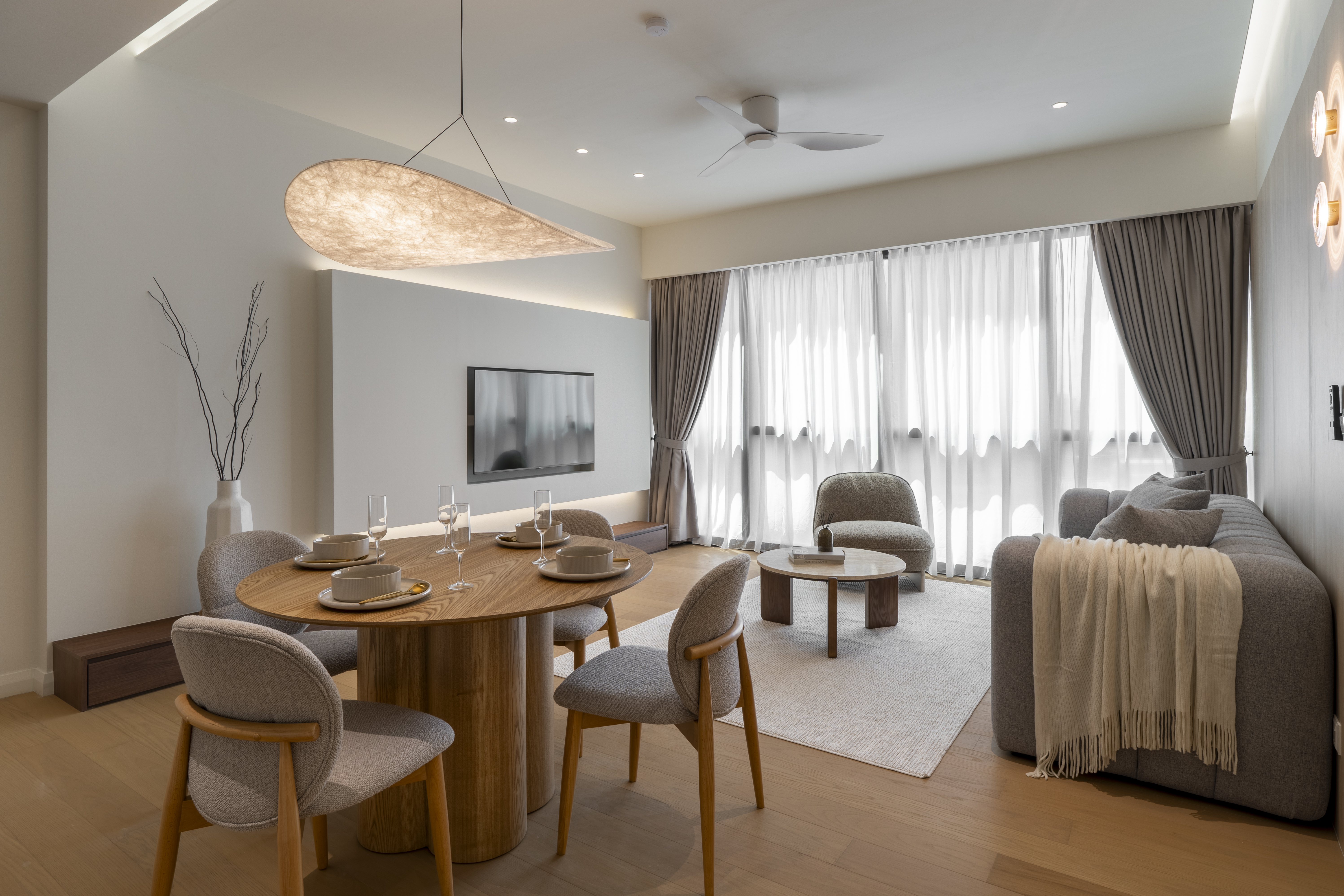 Round dining table looking towards the lounge at TRX Residence Unit 02